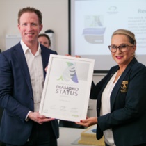 Austin Health CEO (Interim) Cameron Goodyear and Angels Initiative representative Samantha Dagasso holding framed certificate of WSO Angels Diamond Award awarded to Austin Health for excellence in stroke care.